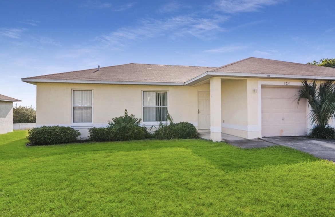 Legend Court Duplexes exterior with garage